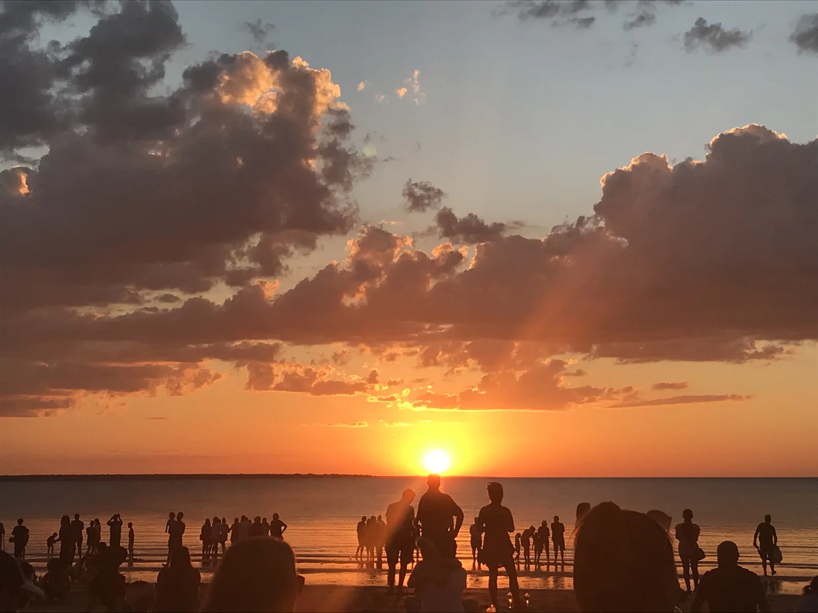 Sunset gathering on the sand