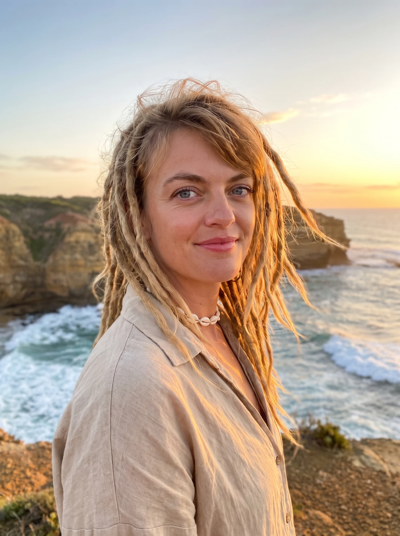 Mel on a coastal headland at golden hour